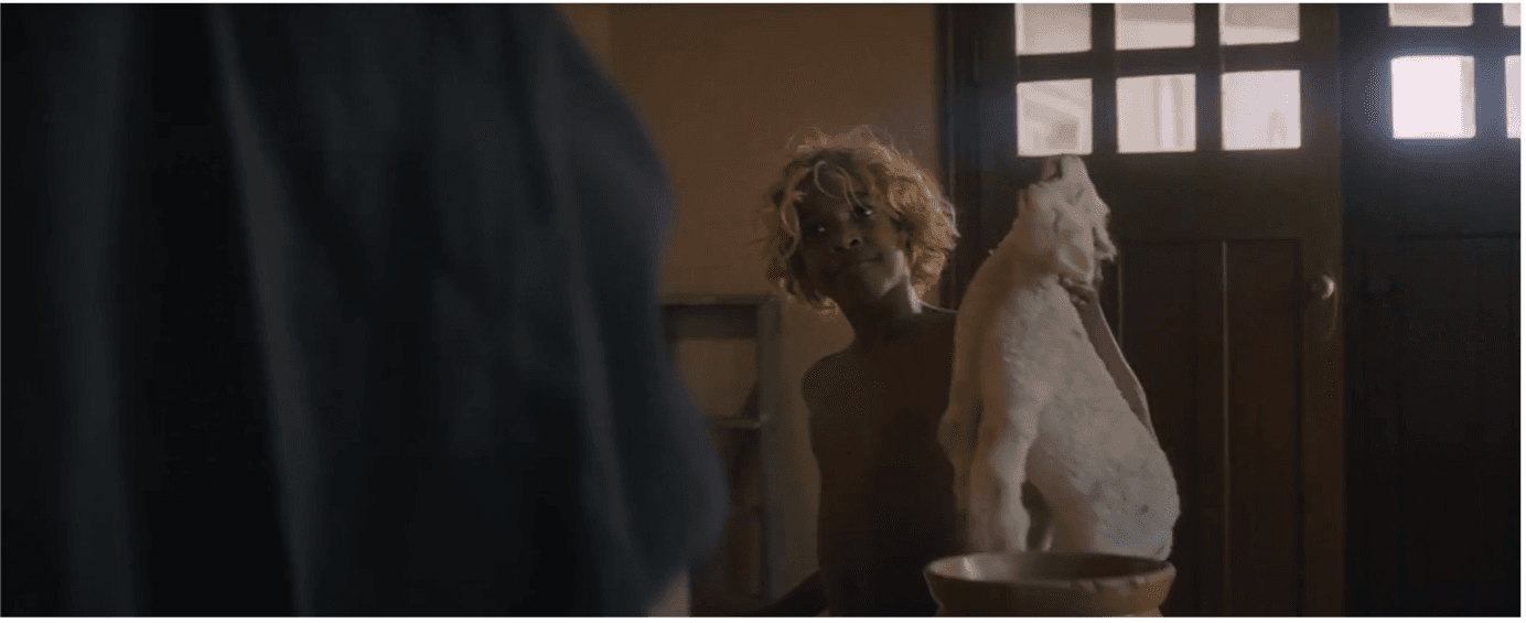 New Boy with lambs in church